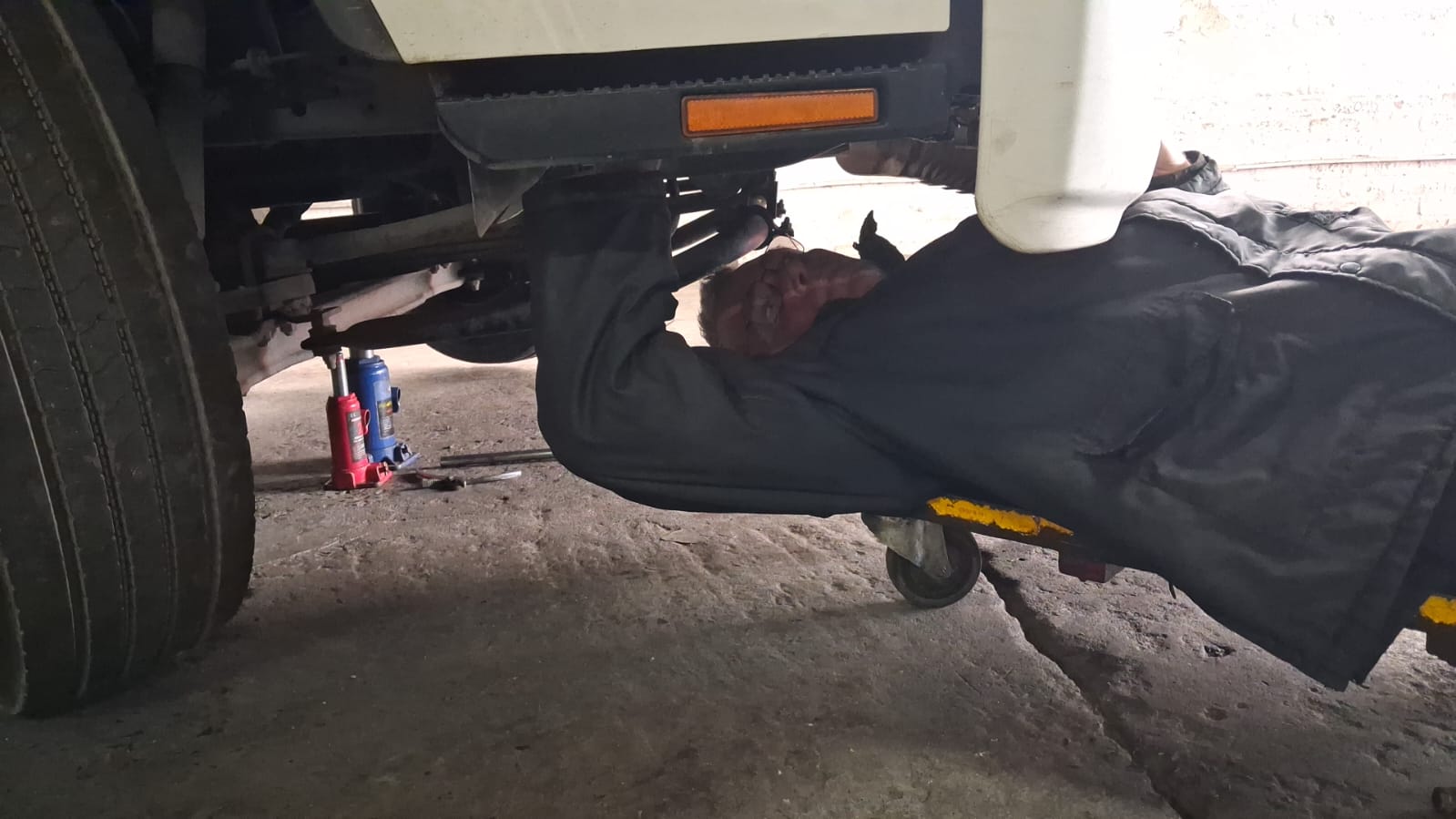 DTL mechanic in welding gear at the workshop bench